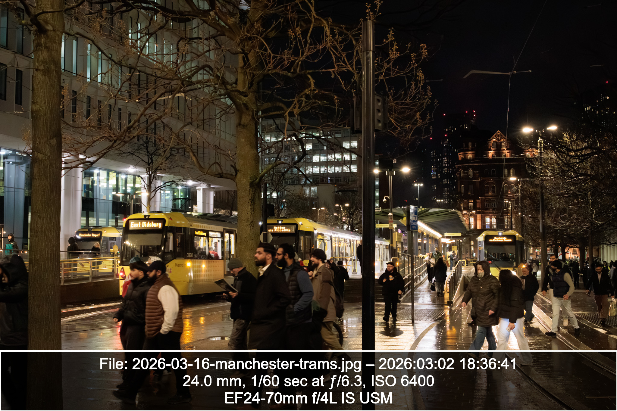 Photograph of St Peter's Square tram station in Manchester. The image is captioned with the camera settings.